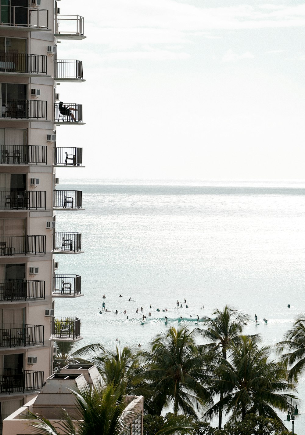 brown and white concrete building near body of water during daytime