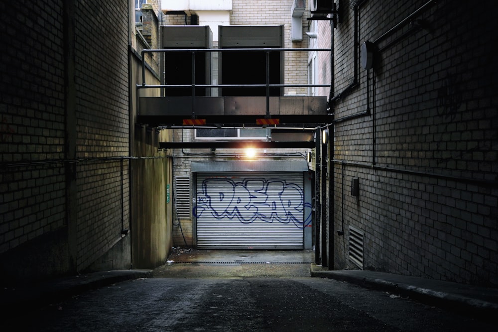 black metal gate near gray concrete building during daytime