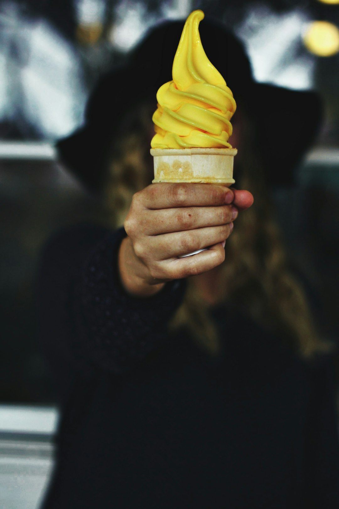 person holding ice cream cone