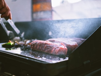 raw meat on black tray