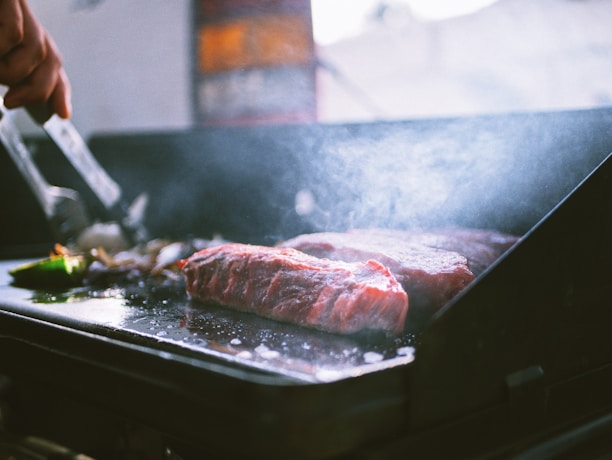 raw meat on black tray