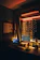A cozy workspace with a laptop open to a chat group, warm lighting.