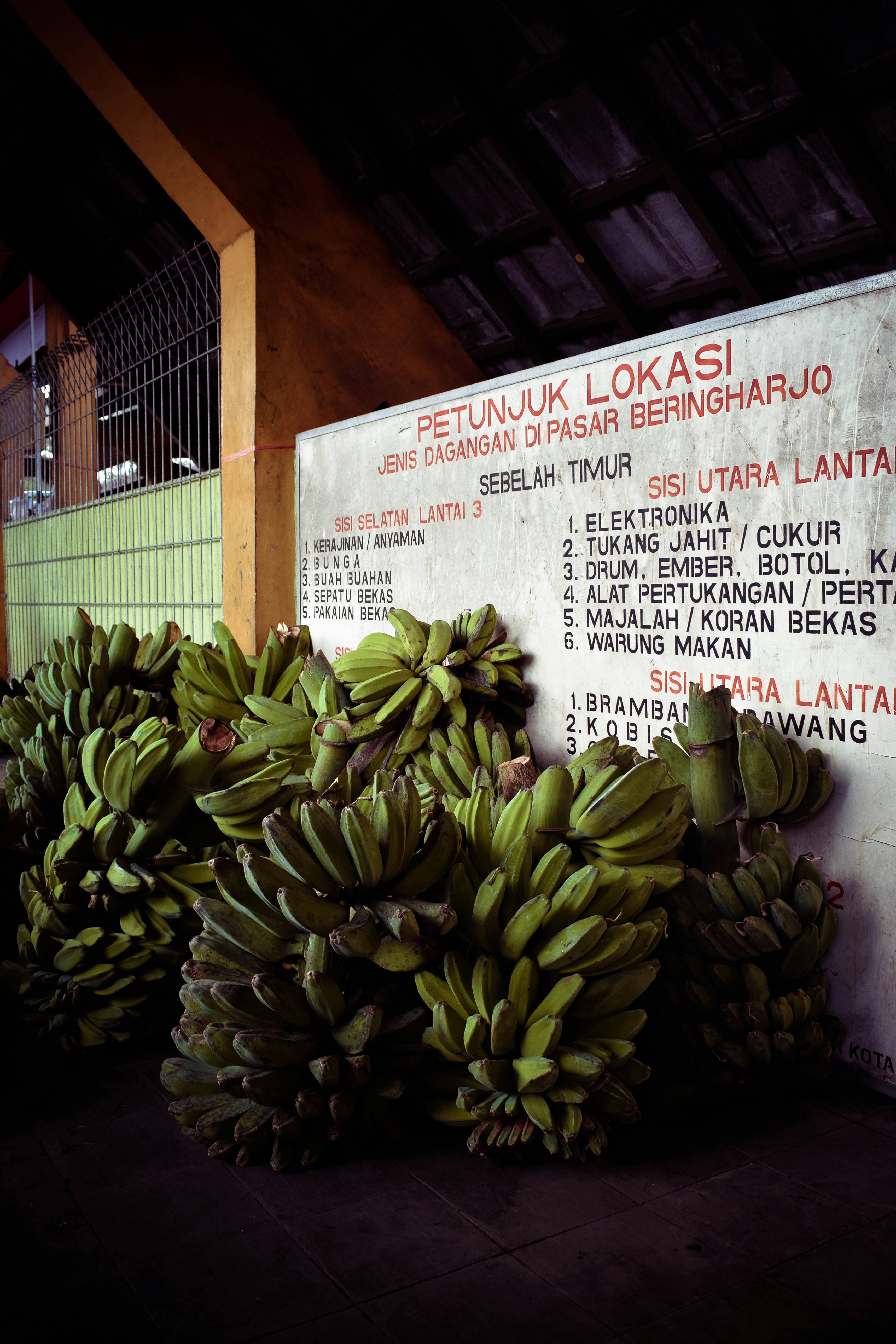 green banana fruit on newspaper