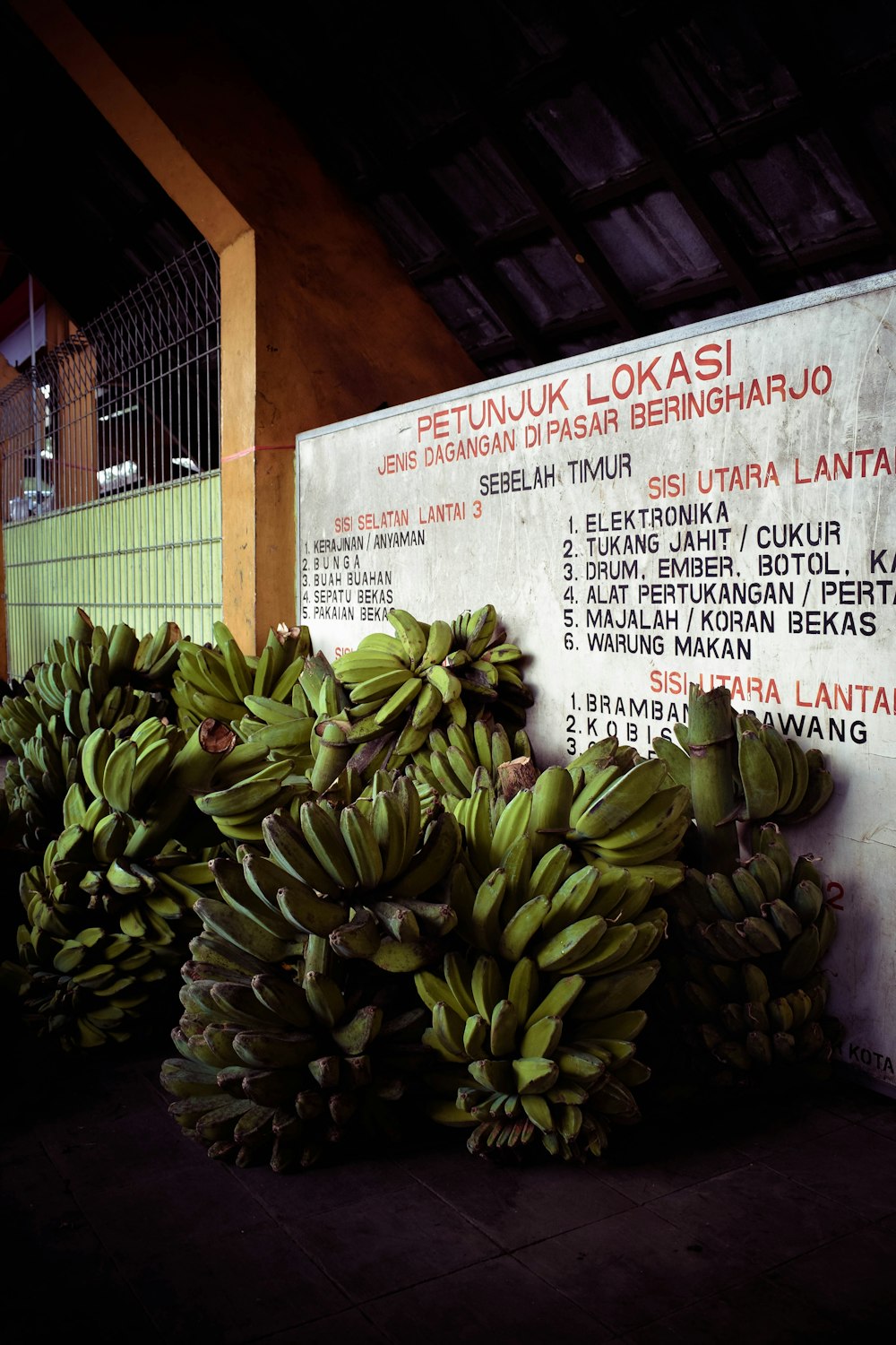 green banana fruit on newspaper