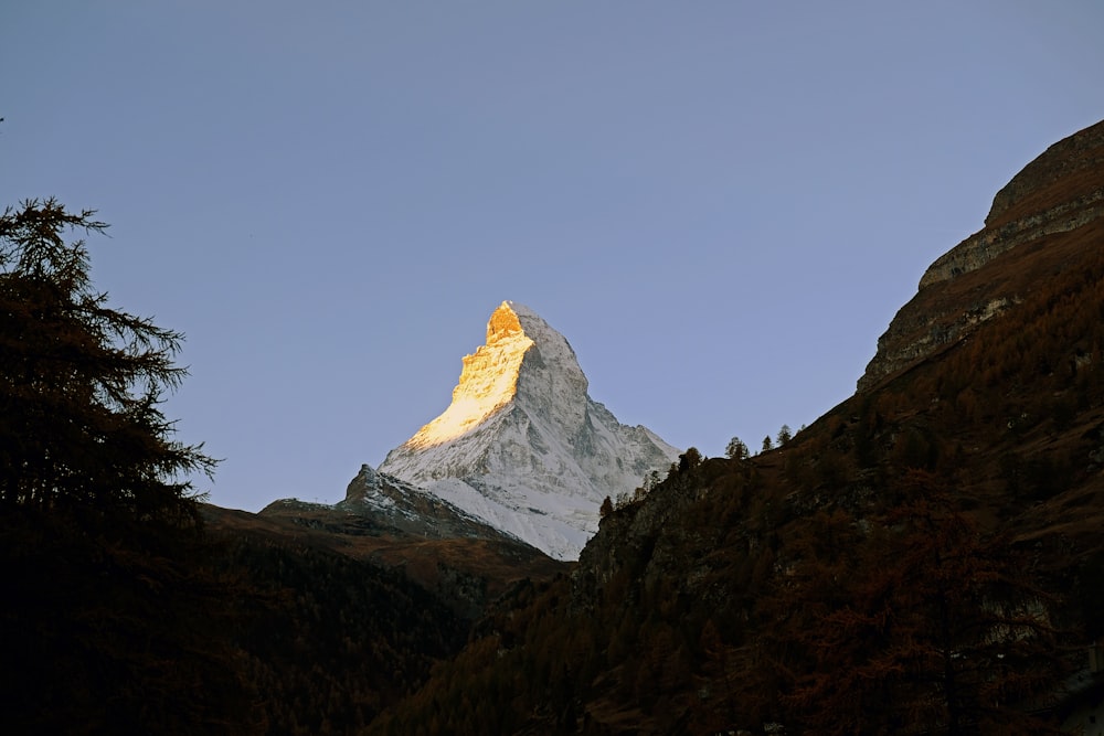 snow covered mountain under blue sky during daytime