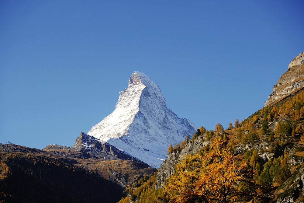 snow covered mountain under blue sky during daytime