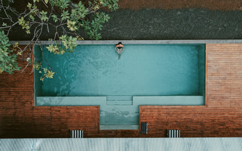 person in swimming pool during daytime