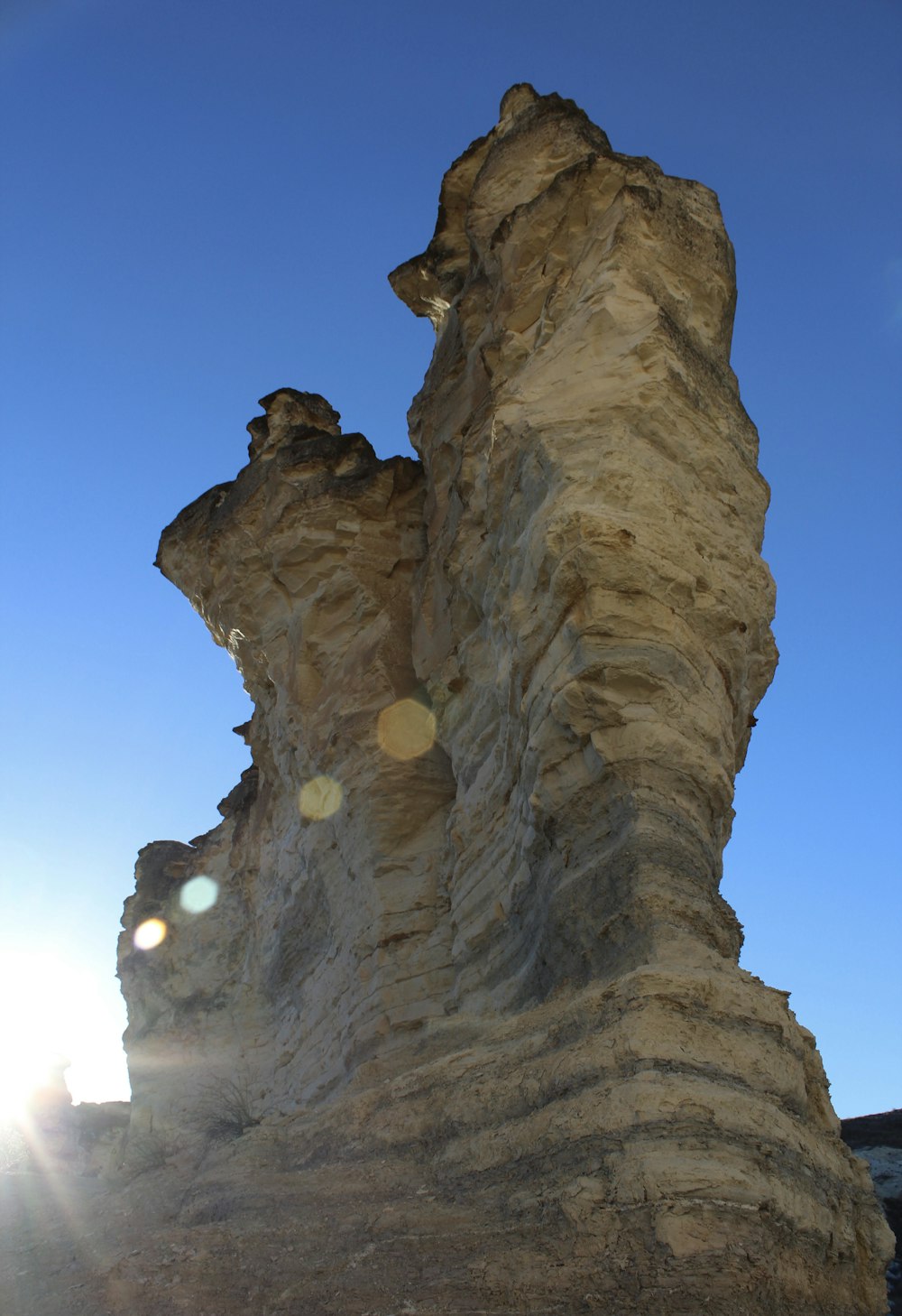 brown rock formation under blue sky during daytime