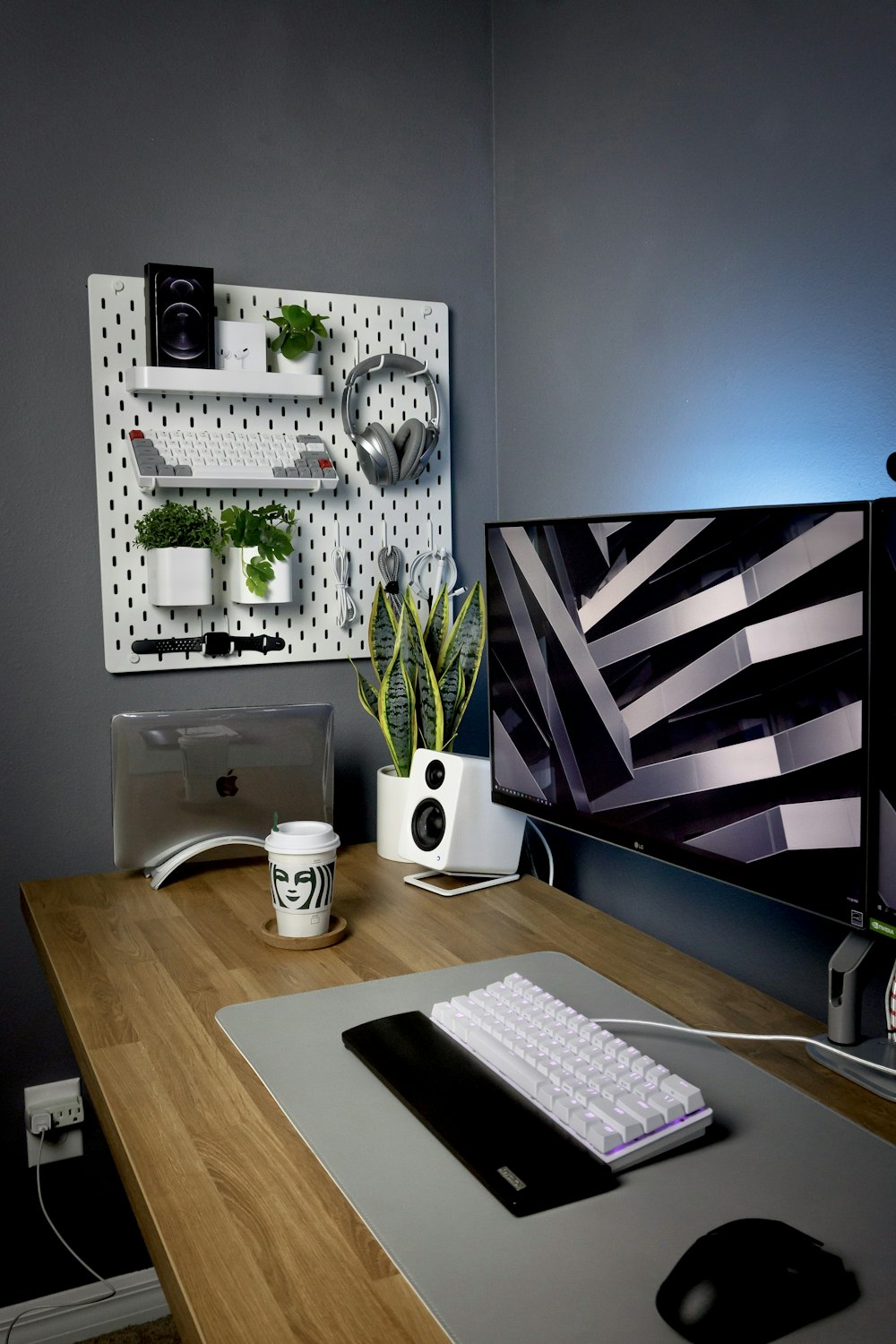 white ceramic mug on brown wooden desk