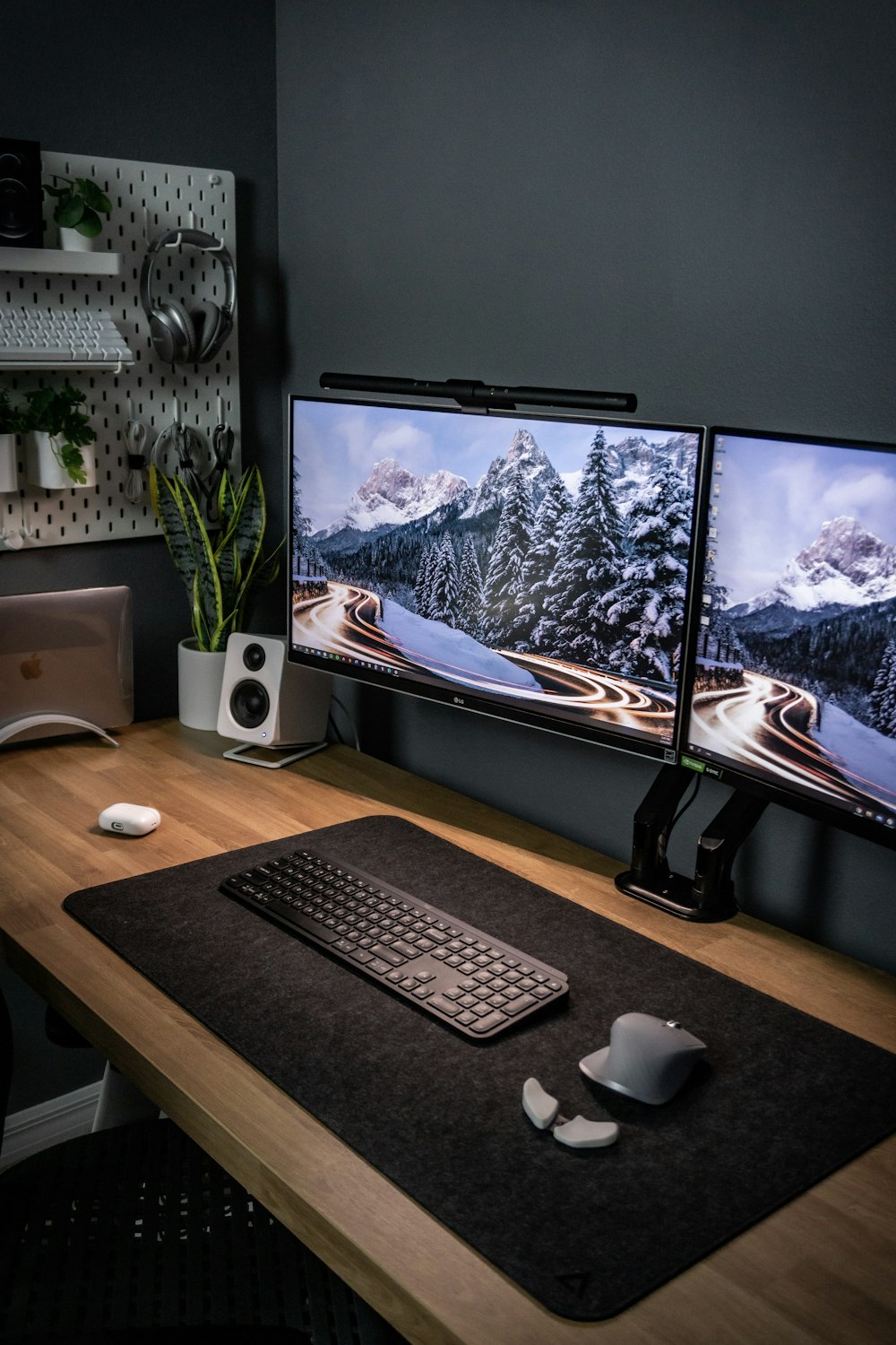 black flat screen computer monitor on brown wooden desk