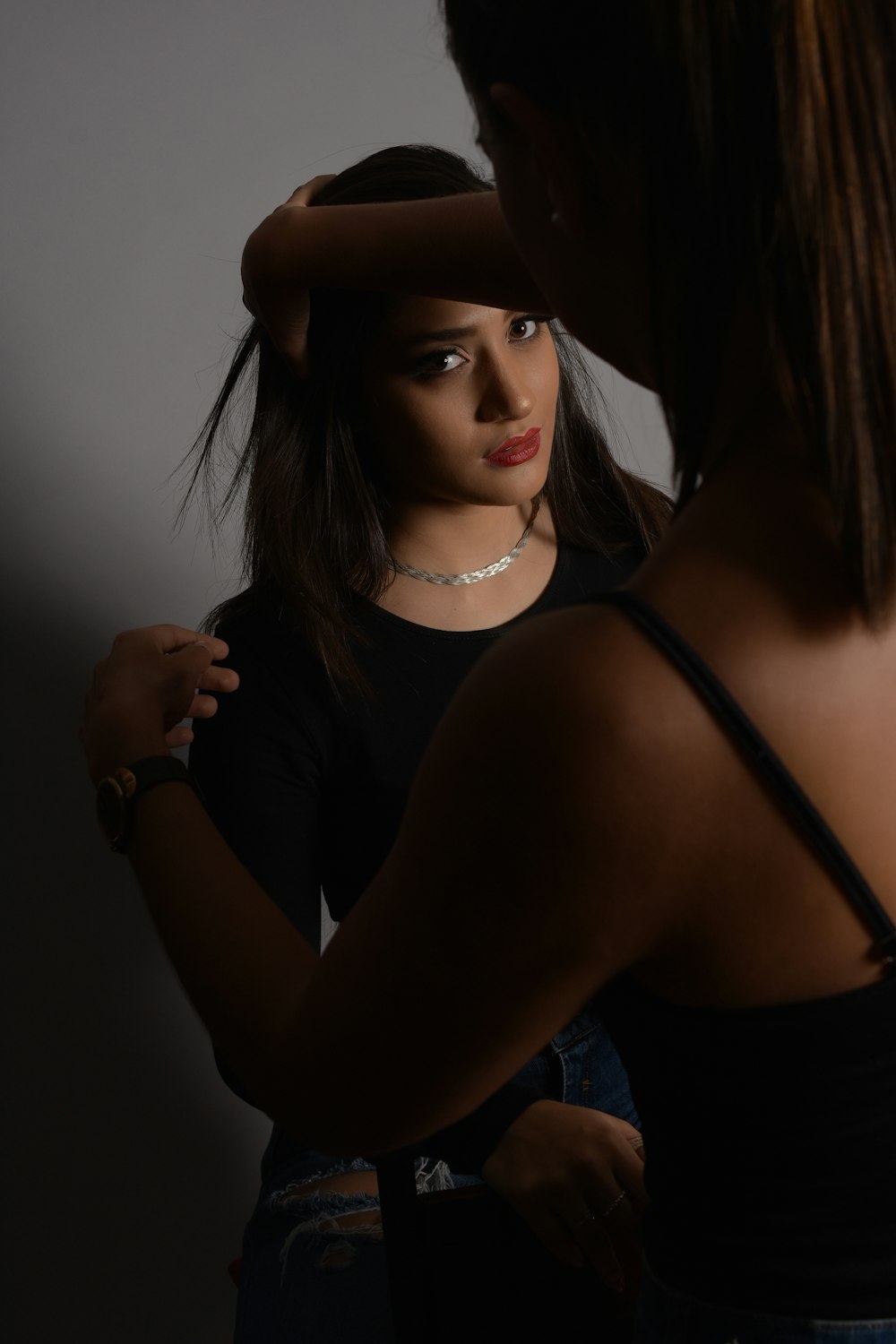 woman in black tank top and black hat