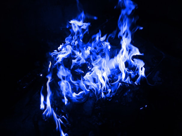 Close-up of the vibrant blue flames at Ijen Crater during a night tour.