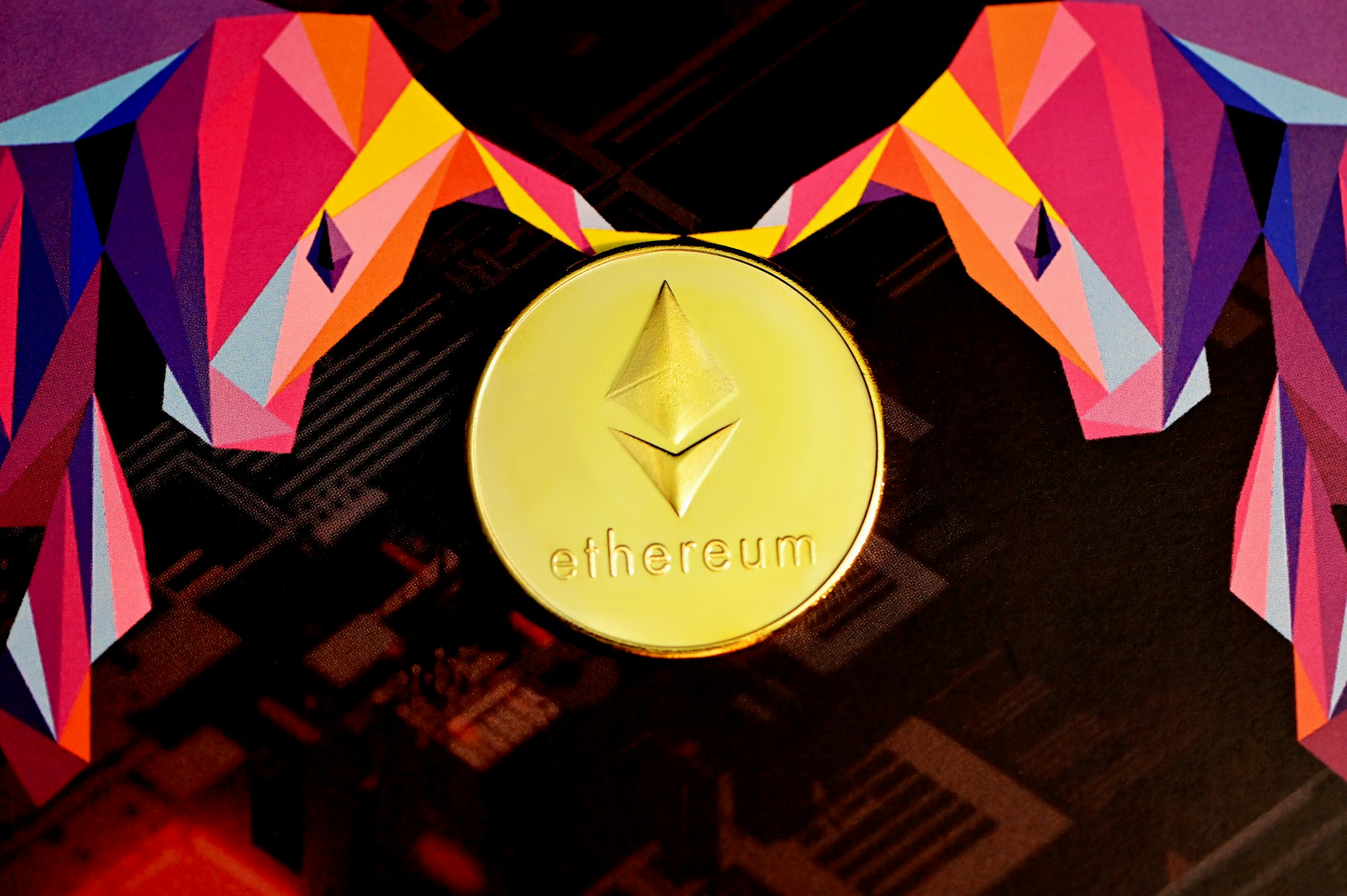 An Ethereum coin in between two executium bull logo.