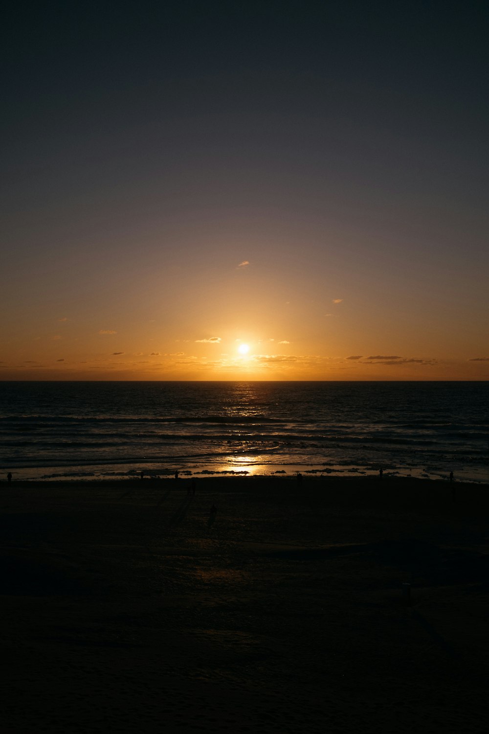 body of water during sunset