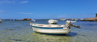 A beautiful motorboat cruising on clear blue coastal waters near Ilhabela.