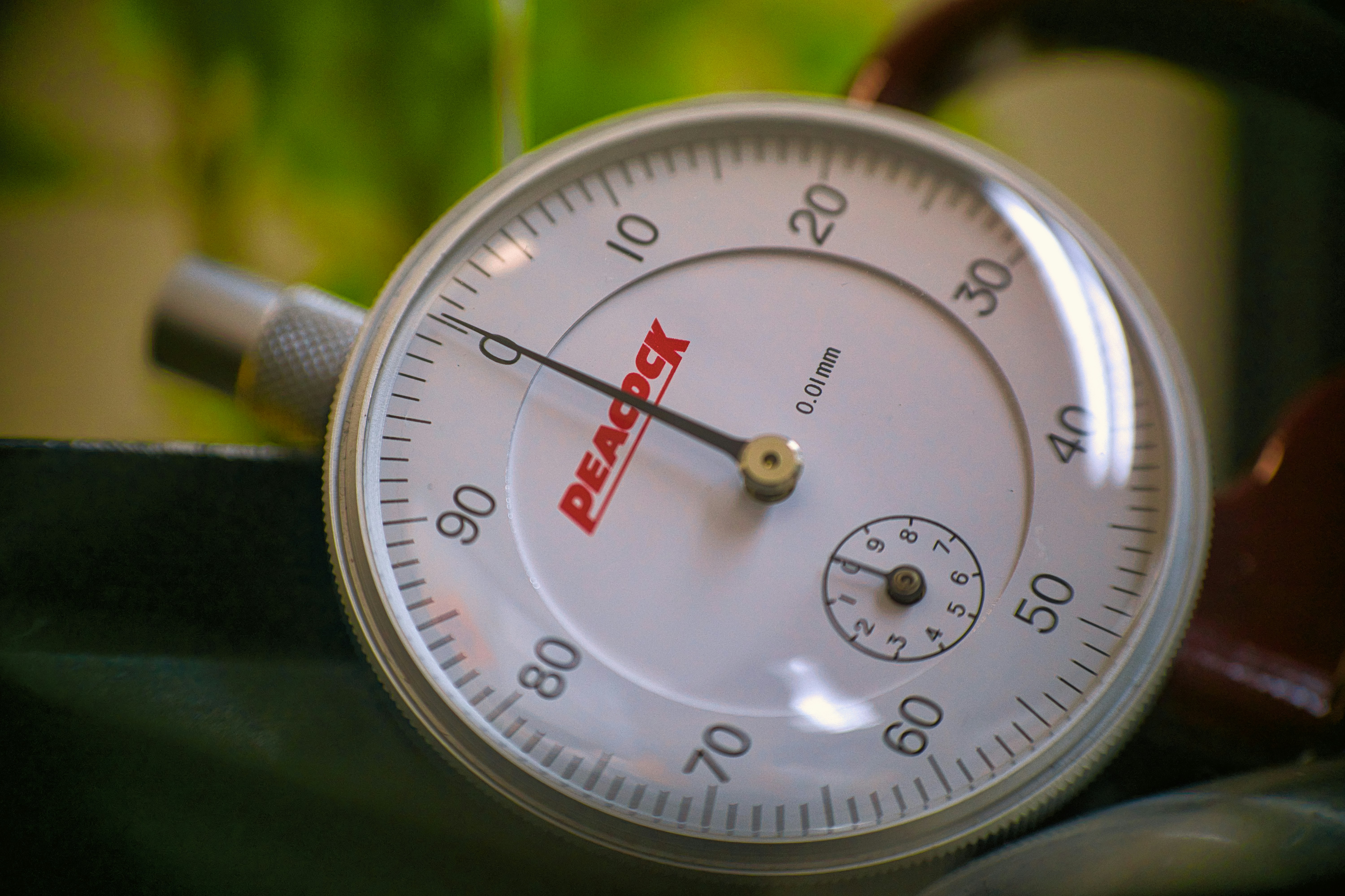 silver round analog watch at 10