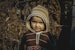 boy in brown and beige knit cap