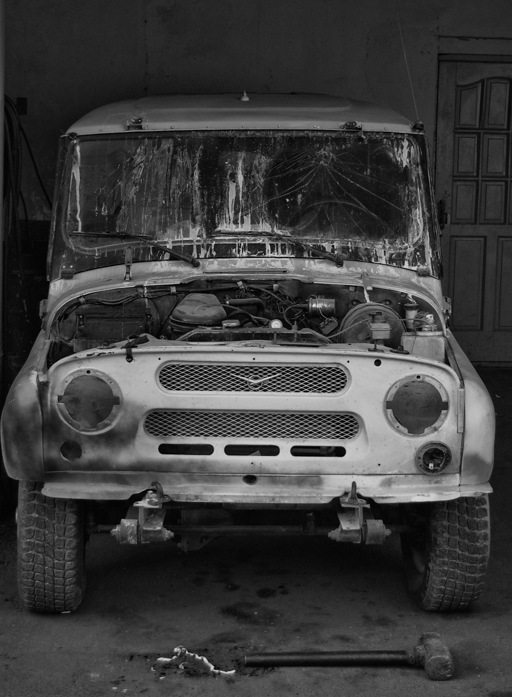 grayscale photo of vintage car