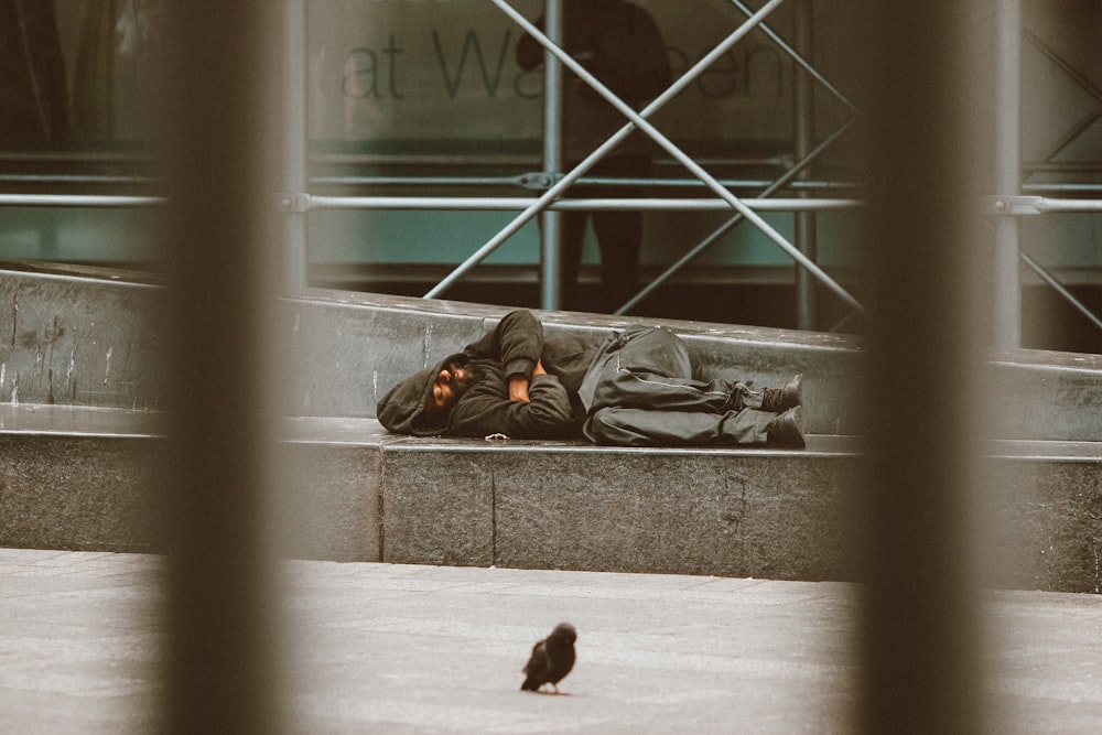 woman lying on floor near window