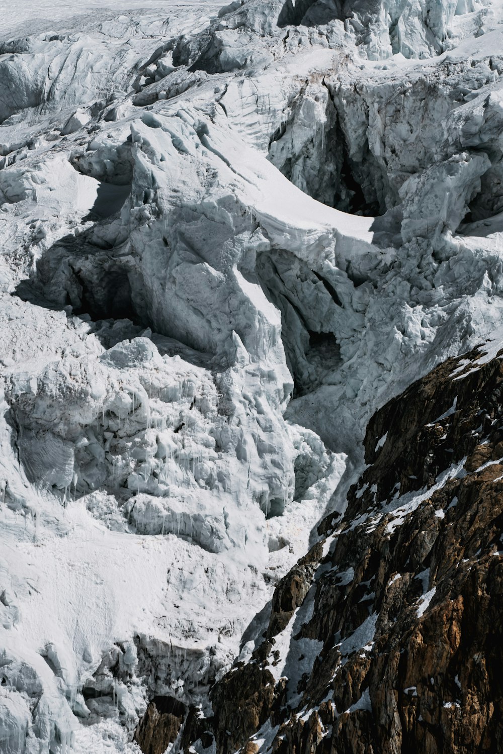 snow covered mountain during daytime