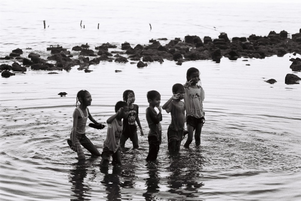 children playing on water during daytime
