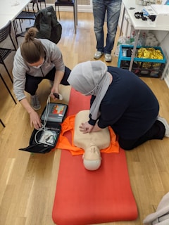 2 women doing CPR