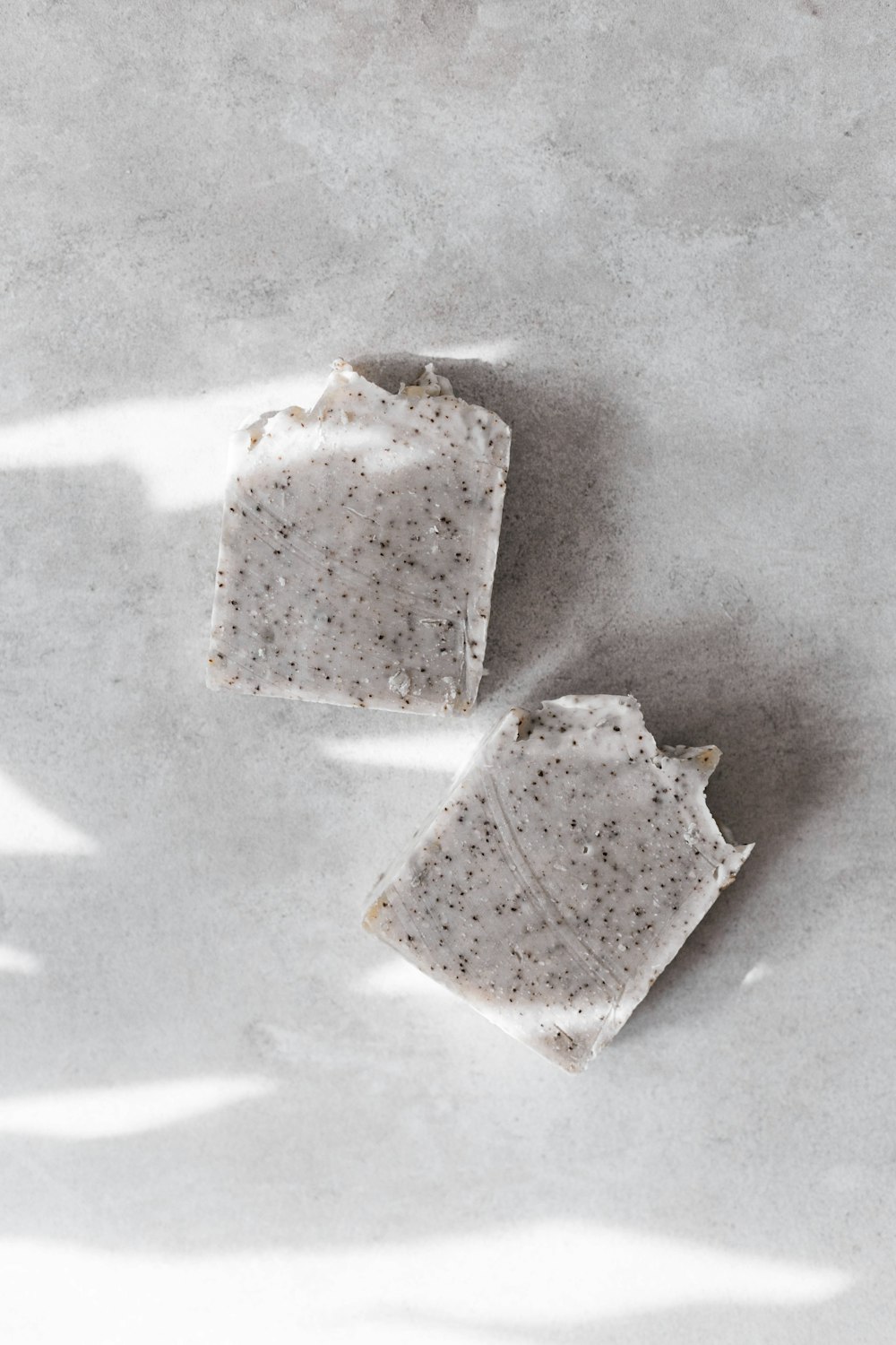 three white and brown pastries