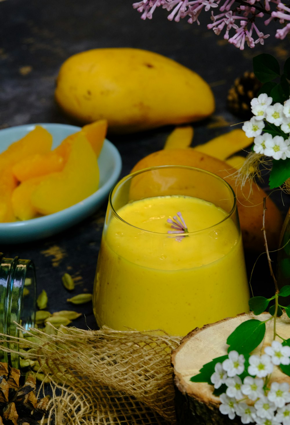 yellow juice in clear drinking glass