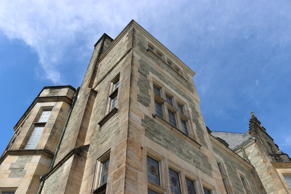 brown concrete building under blue sky during daytime