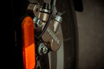 orange and silver bicycle wheel