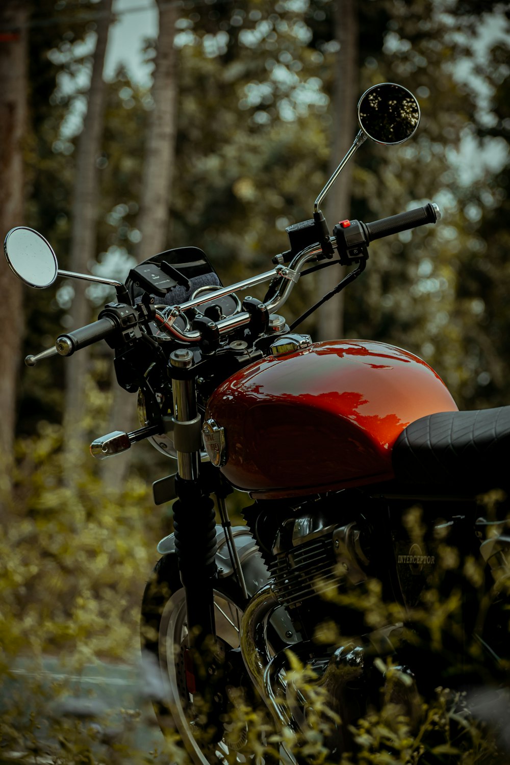 red and black motorcycle in tilt shift lens