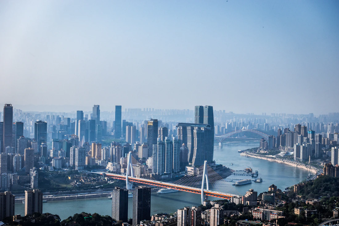 Chongqing's illuminated skyline and riverfront seen at night from across the water