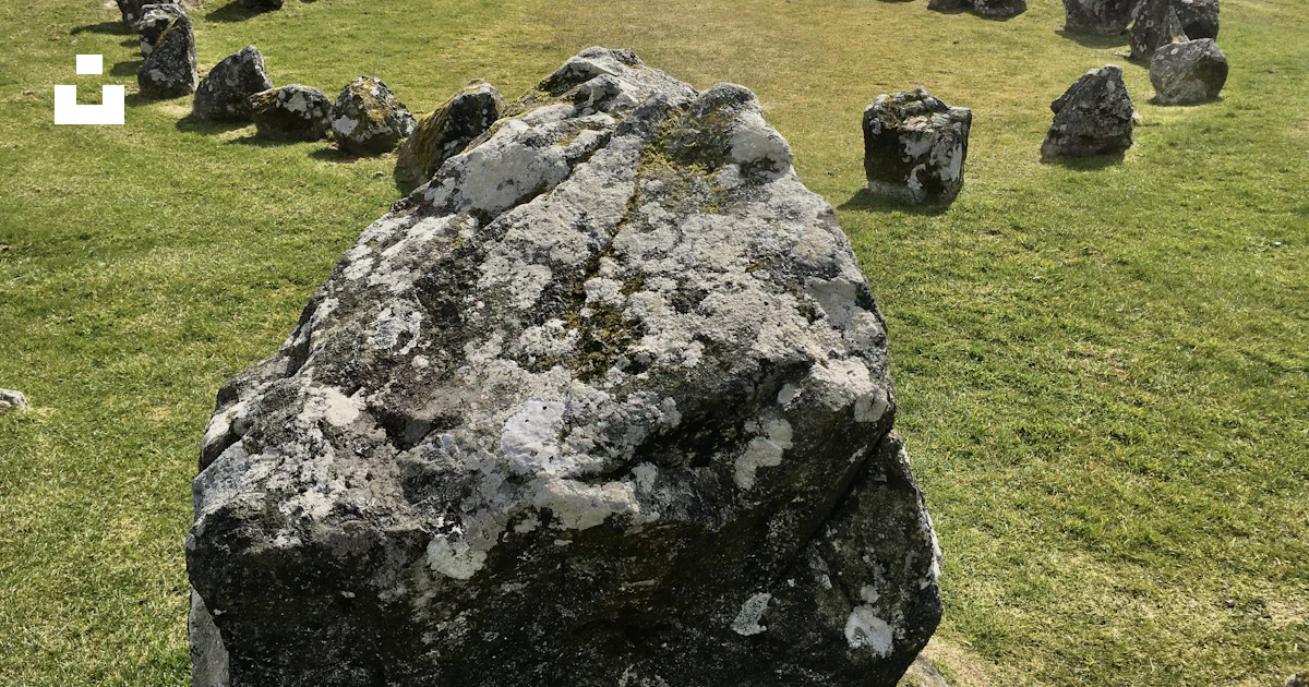 Gray rock formation on green grass field during daytime photo – Free ...