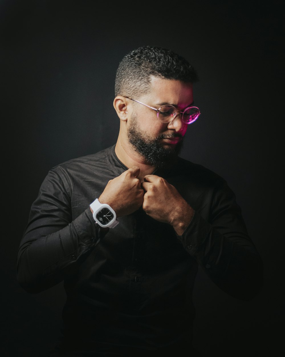 man in black long sleeve shirt wearing black sunglasses