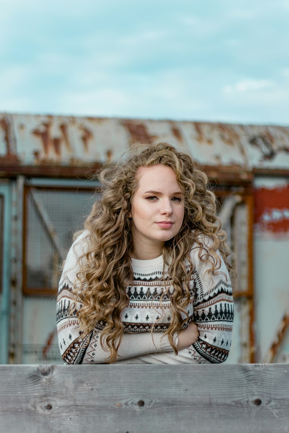 woman in white and black tribal long sleeve shirt