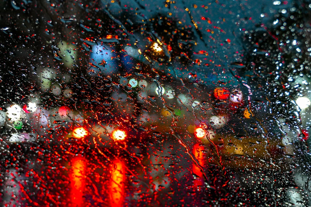 water droplets on glass during night time