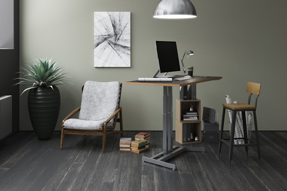 silver laptop computer on brown wooden table