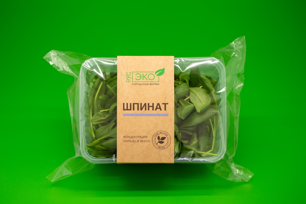 green plastic pack on green textile