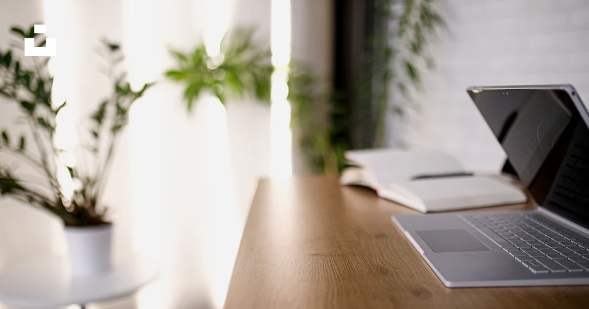 Silver macbook on brown wooden table photo – Free Desk Image on Unsplash