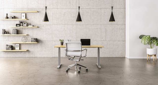 Minimalist office desk with legal books and a pen on brown wooden surface