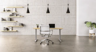 Lifestyle photo of a warm walnut wood office desk with minimalist Moroccan décor in a bright room