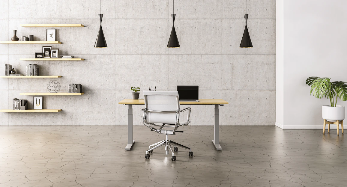 Lifestyle photo of a warm walnut wood office desk with minimalist Moroccan décor in a bright room