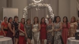 A group of women enjoying a fashion event together.