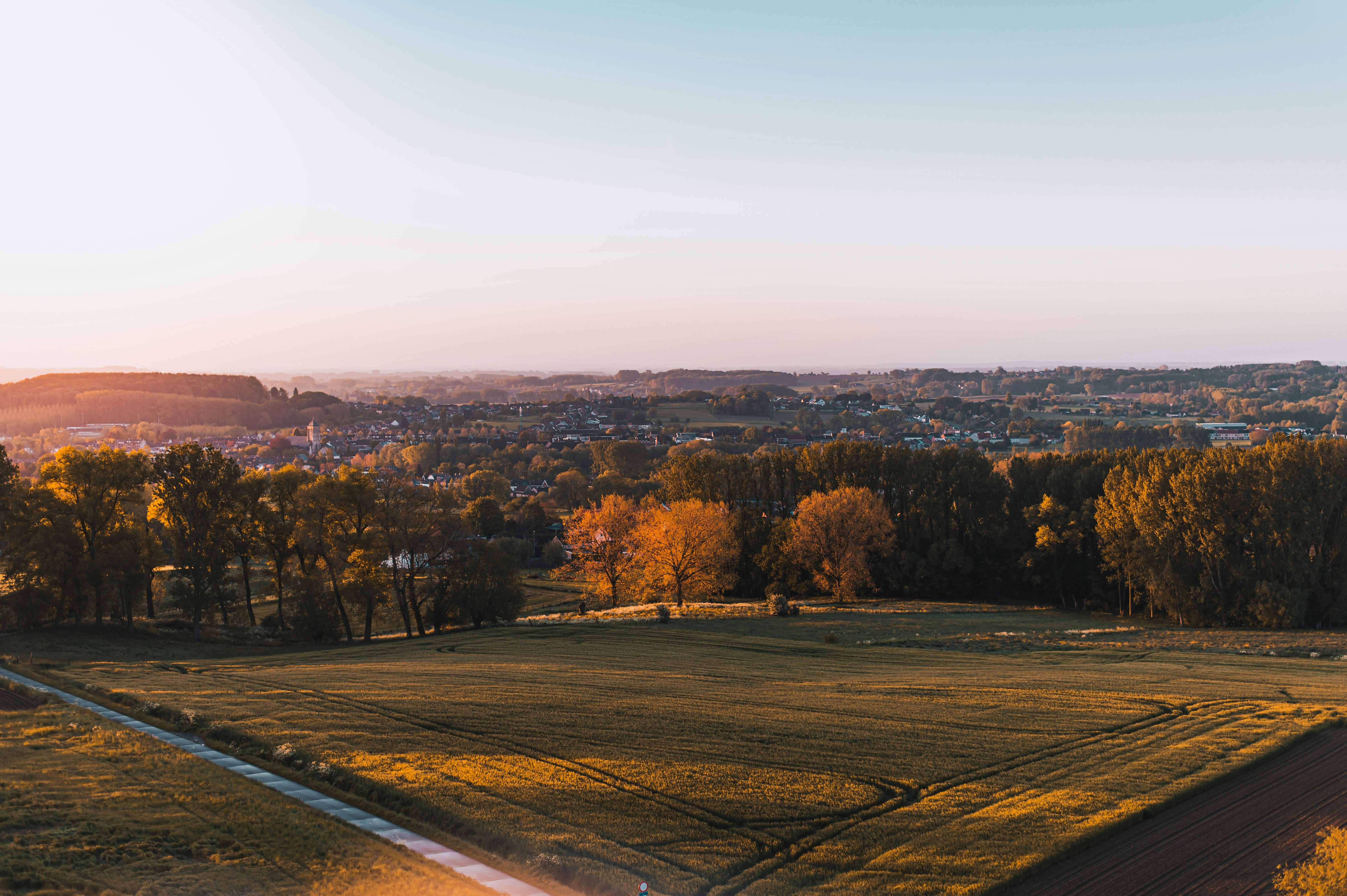 A beautiful sunrise over a farm.
