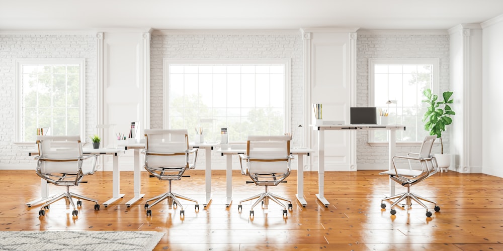 a room that has a bunch of chairs in it