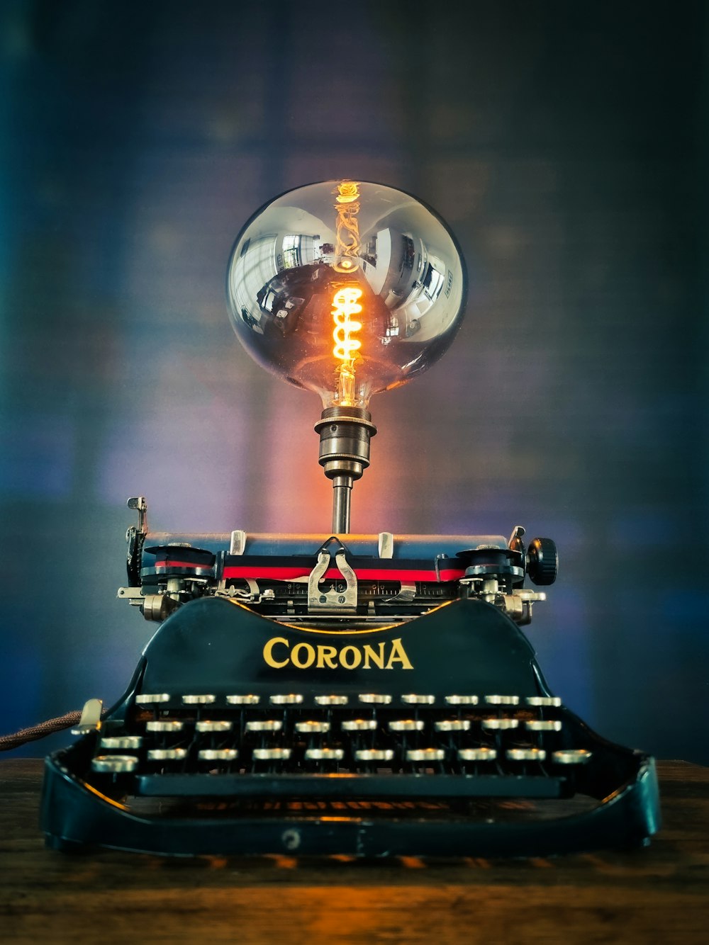 black and red typewriter on table