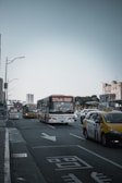 A busy street scene with various transport vehicles.