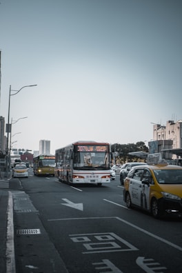 A busy street scene with various transport vehicles.