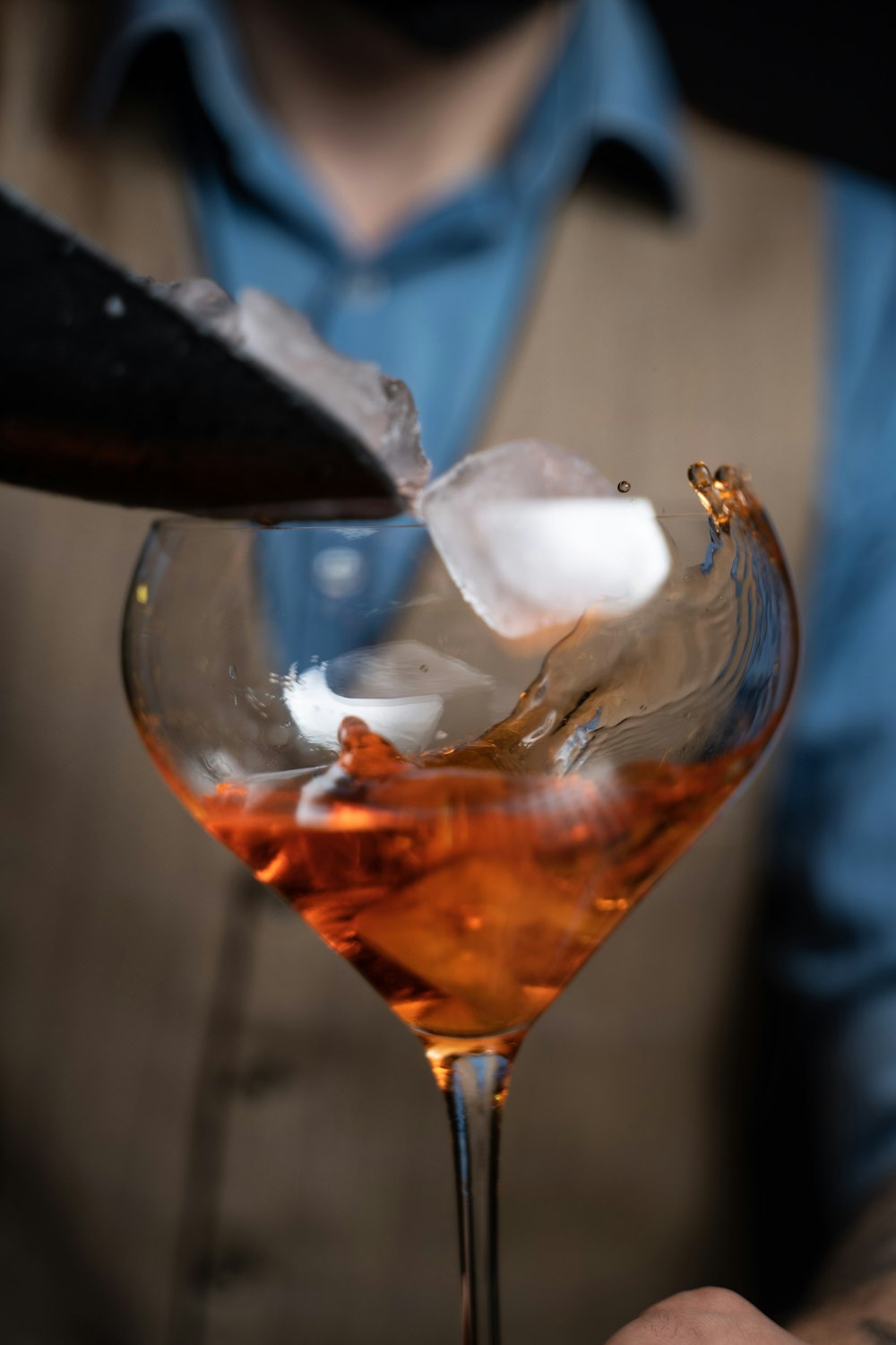 clear wine glass with brown liquid