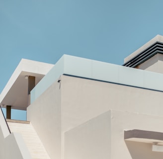 white concrete building under blue sky during daytime